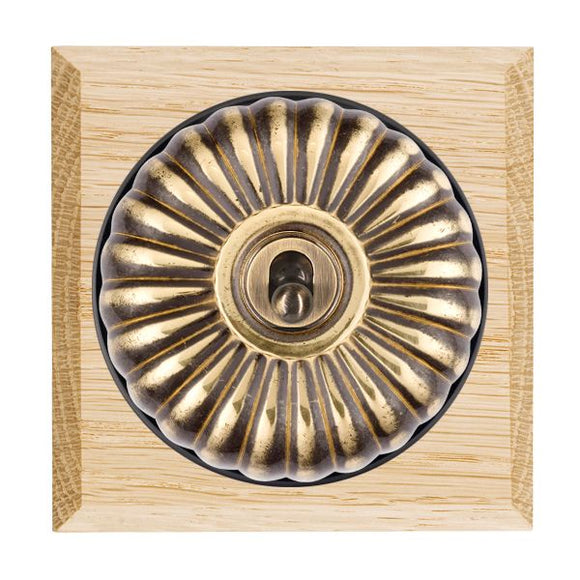Hamilton BCLFT21AB-B Bloomsbury Chamfered Light Oak 1 gang 20AX 2 Way Toggle Antique Brass Fluted Dome/Black Collar Insert