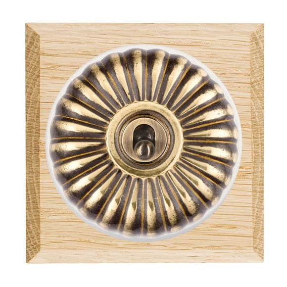 Hamilton BCLFT21AB-W Bloomsbury Chamfered Light Oak 1 gang 20AX 2 Way Toggle Antique Brass Fluted Dome/White Collar Insert